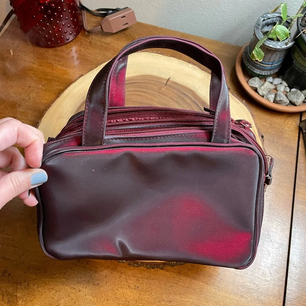 Deep burgundy iridescent handbag make up bag roomy storage opens wide zipper